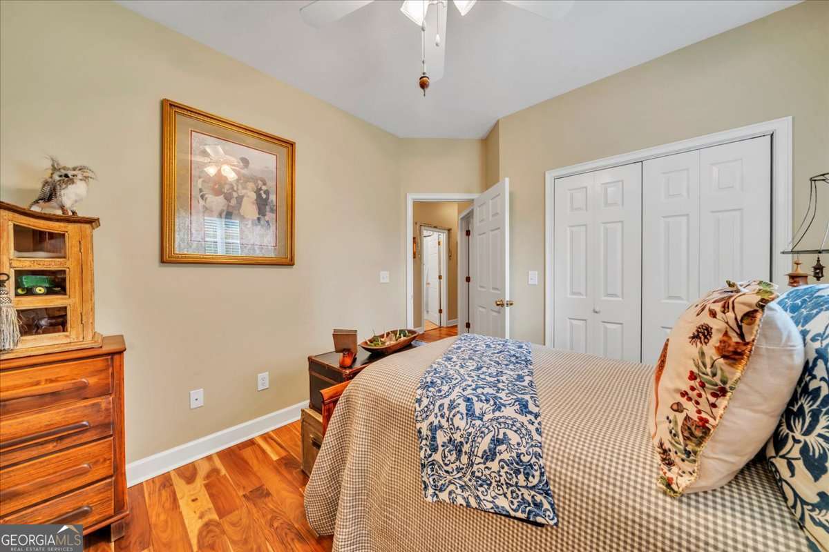 153 Landing Road Cordele, GA 31015 - Photo 30 of 62 a bedroom with a bed and a painting on the wall