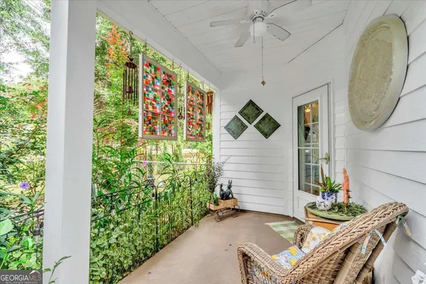 a view of a house with backyard fountain and sitting area
