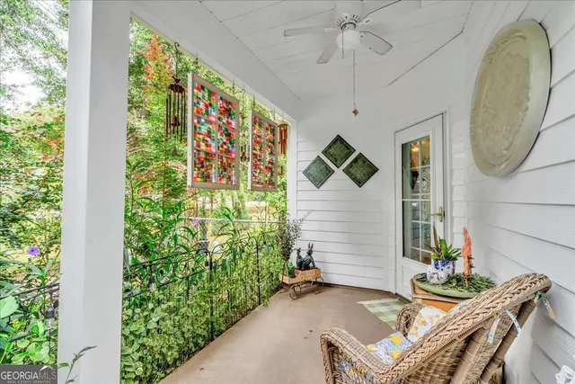 a view of a house with backyard fountain and sitting area