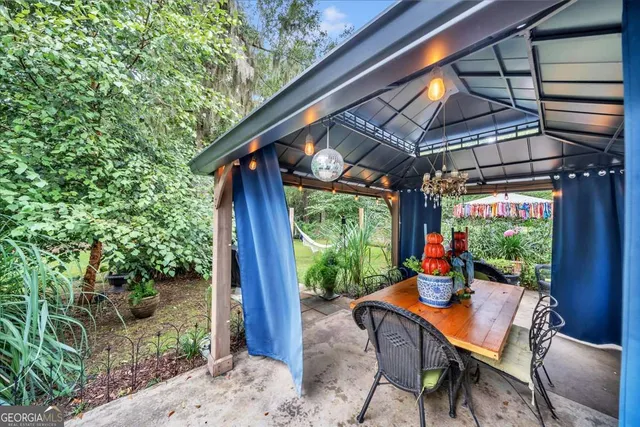 a view of a backyard of the house