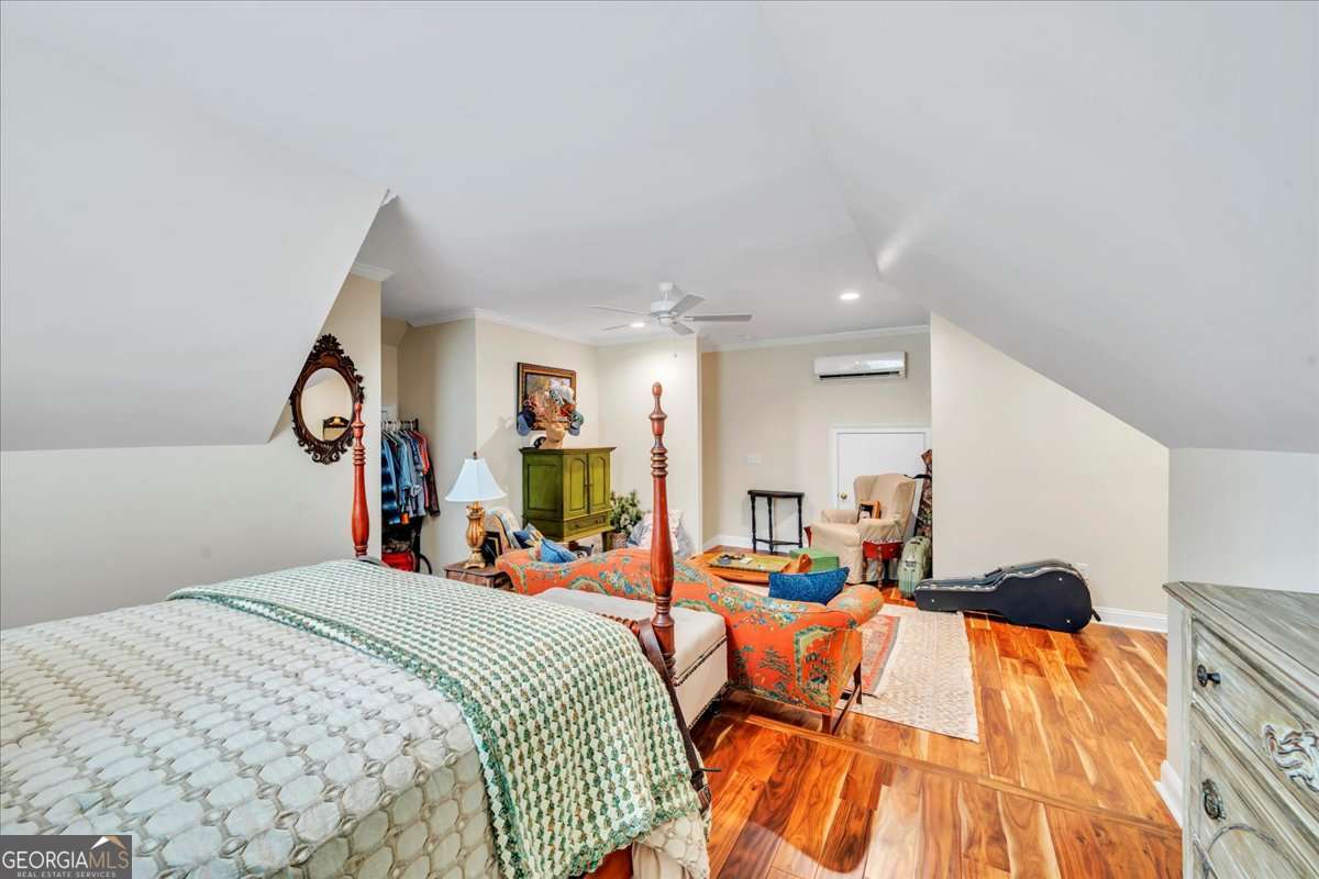 153 Landing Road Cordele, GA 31015 - Photo 38 of 62 a bed room with a bed and mirror