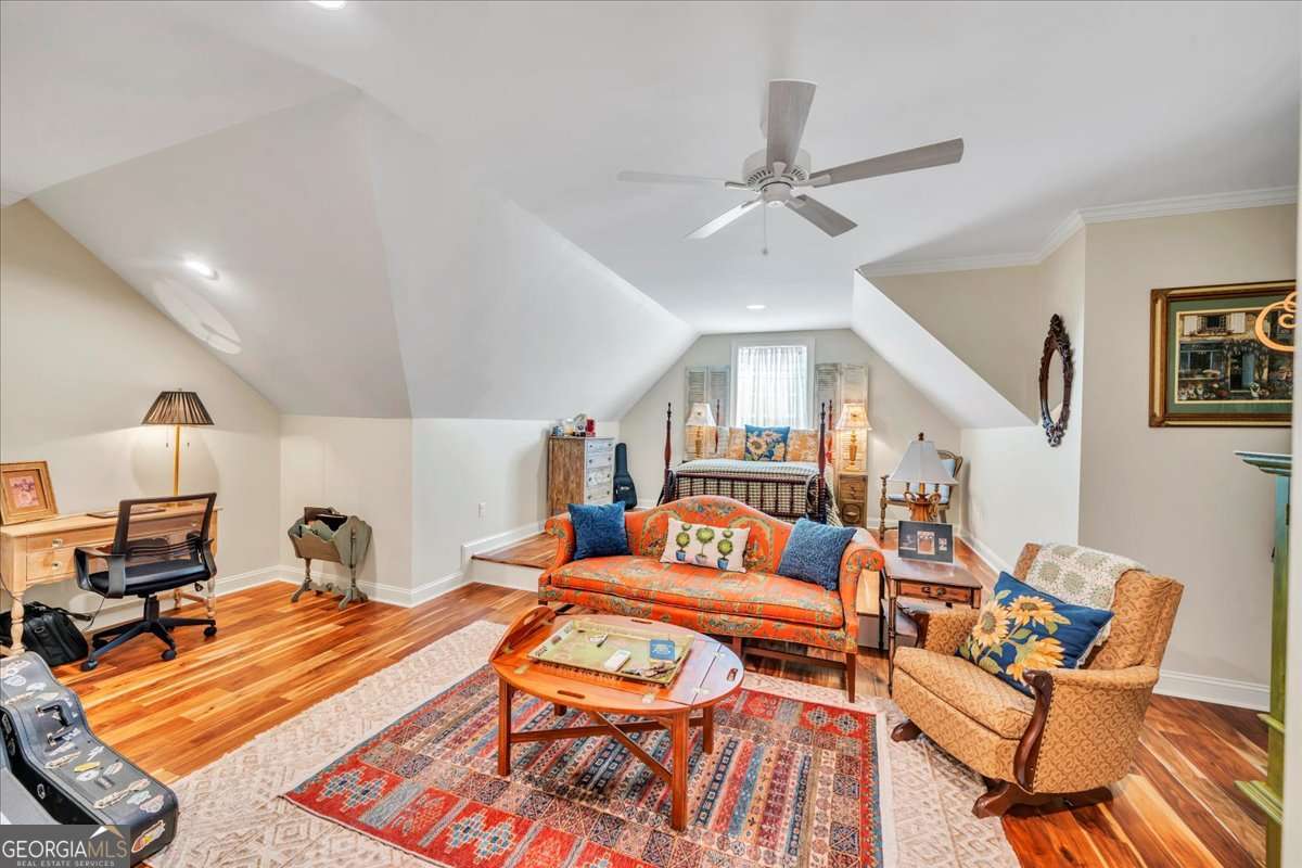 153 Landing Road Cordele, GA 31015 - Photo 39 of 62 a living room with furniture and a wooden floor