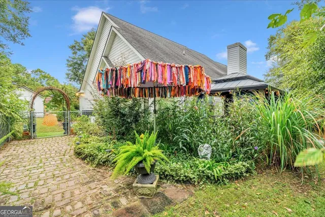 a view of a swimming pool with a yard