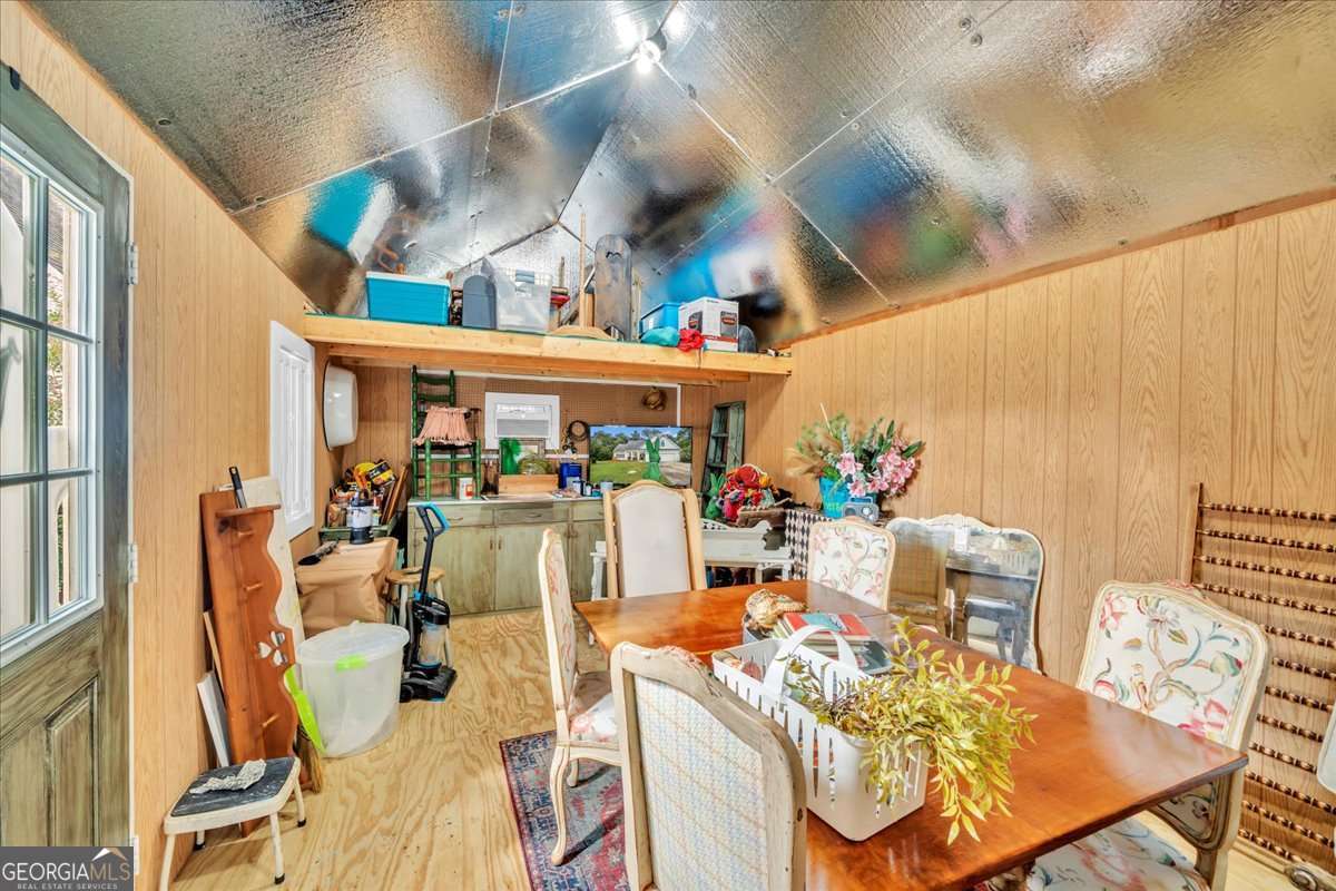 153 Landing Road Cordele, GA 31015 - Photo 48 of 62 a view of a dining room with furniture and a kitchen view