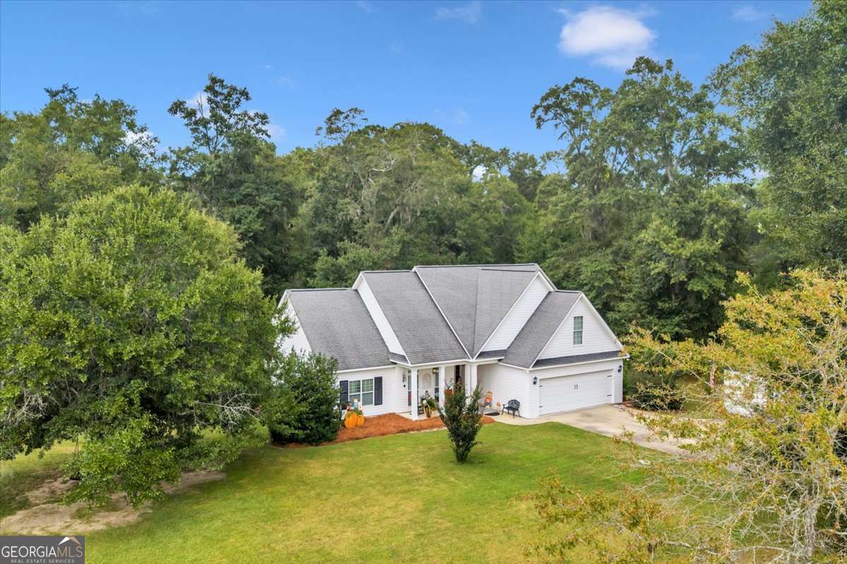 153 Landing Road Cordele, GA 31015 - Photo 51 of 62 an aerial view of a house with a yard table and chairs