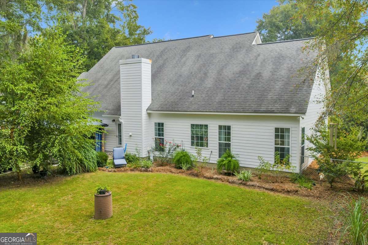 153 Landing Road Cordele, GA 31015 - Photo 59 of 62 a view of a house with a yard and plants