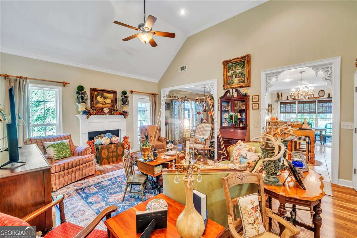 153 Landing Road Cordele, GA 31015 - Photo 6 of 62 a living room with furniture a flat screen tv and a large window