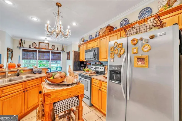 a view of a kitchen with furniture and chandelier