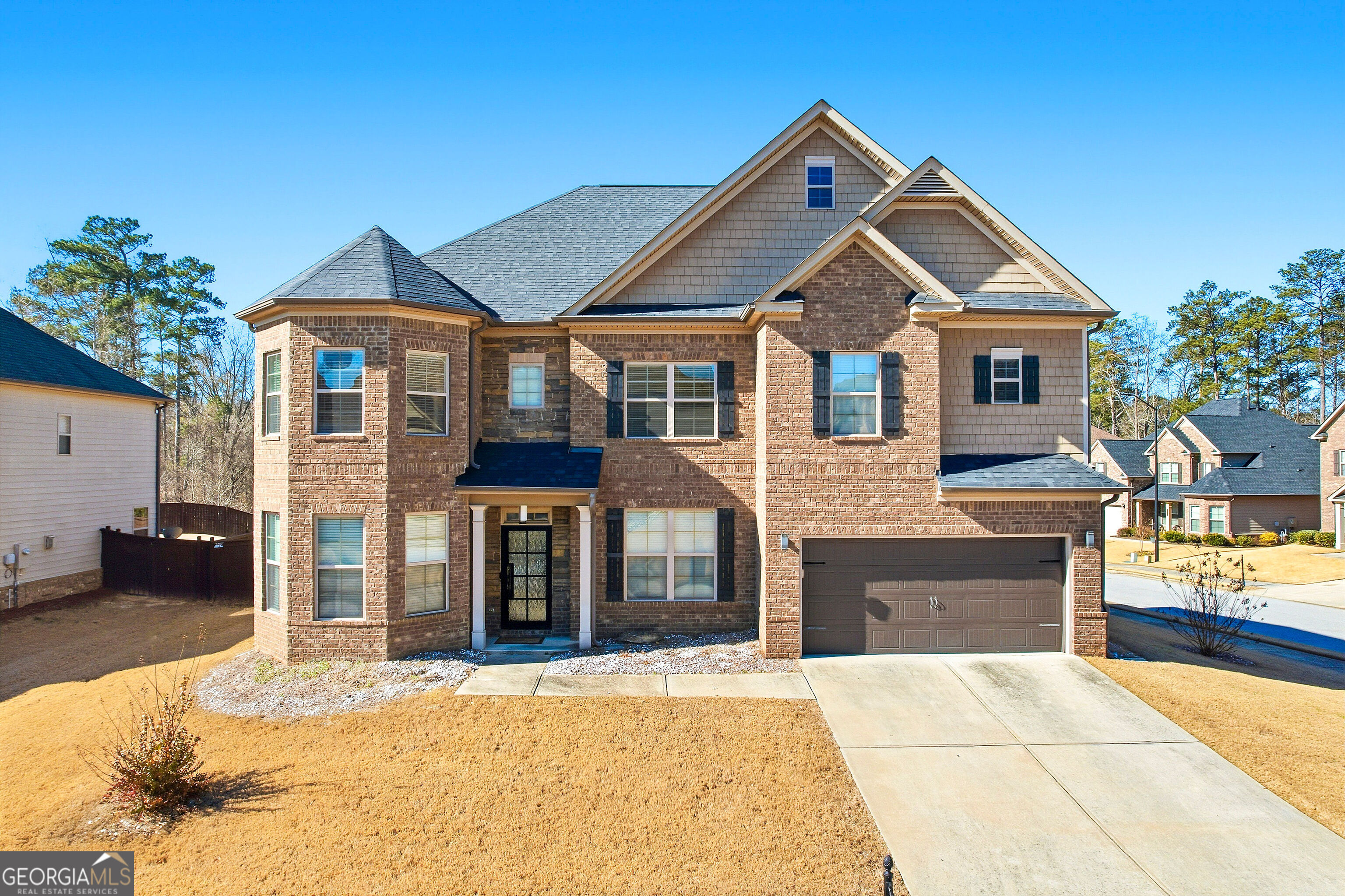 a front view of a house with a yard