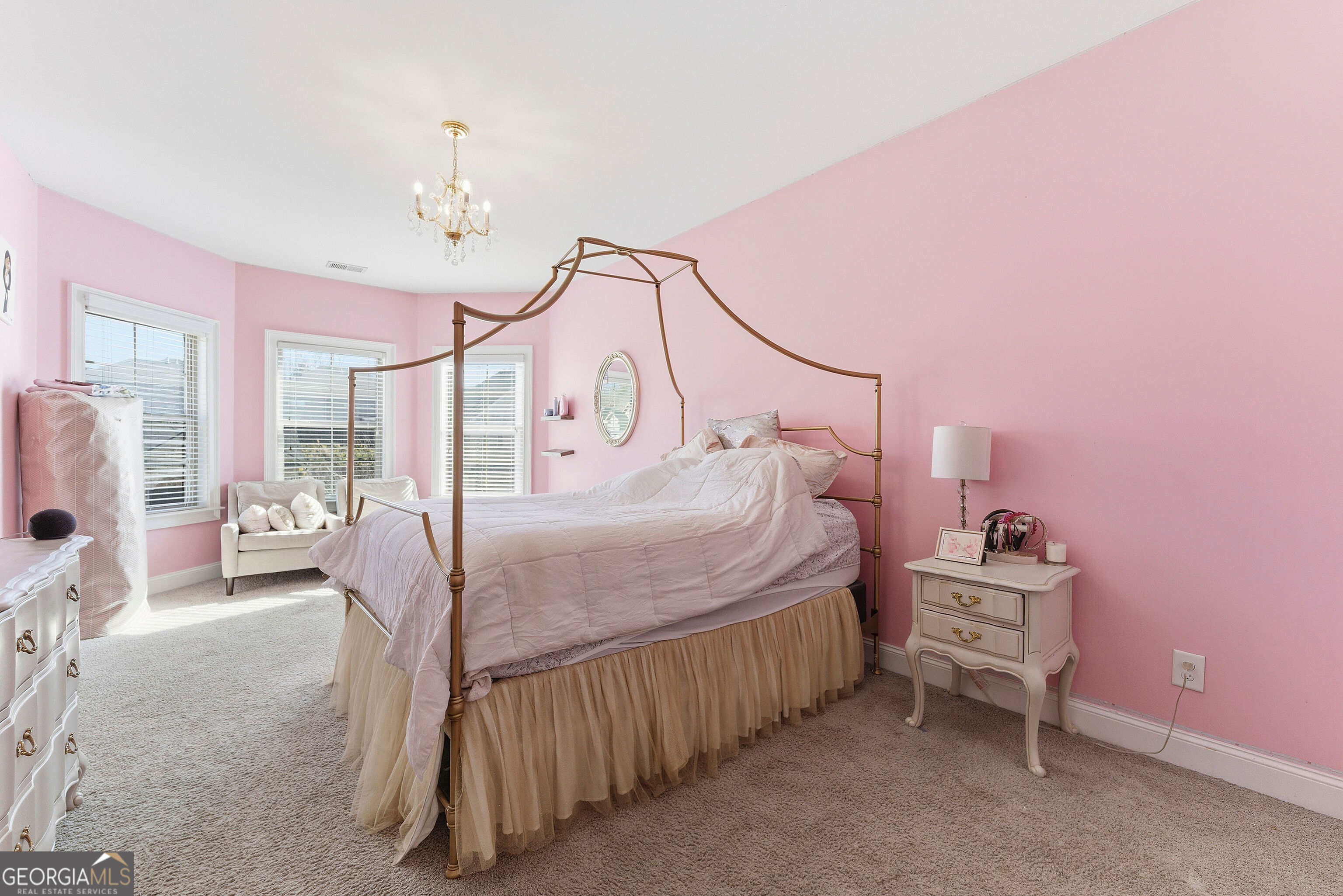 301 Lowell Street Atlanta, GA 30331 - Photo 14 of 28 a bedroom with a bed and a chandelier