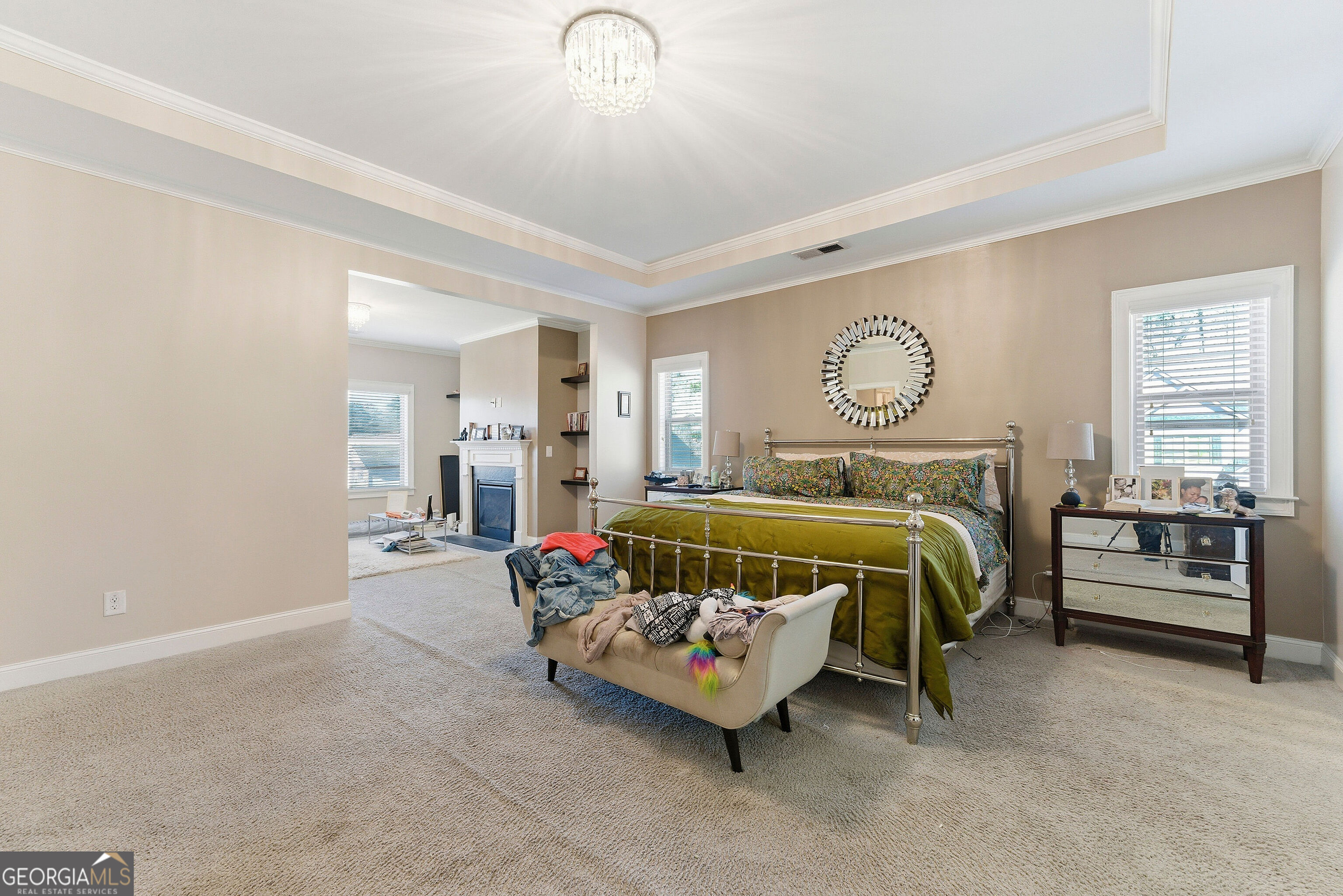 301 Lowell Street Atlanta, GA 30331 - Photo 16 of 28 a bedroom with a bed and a chandelier