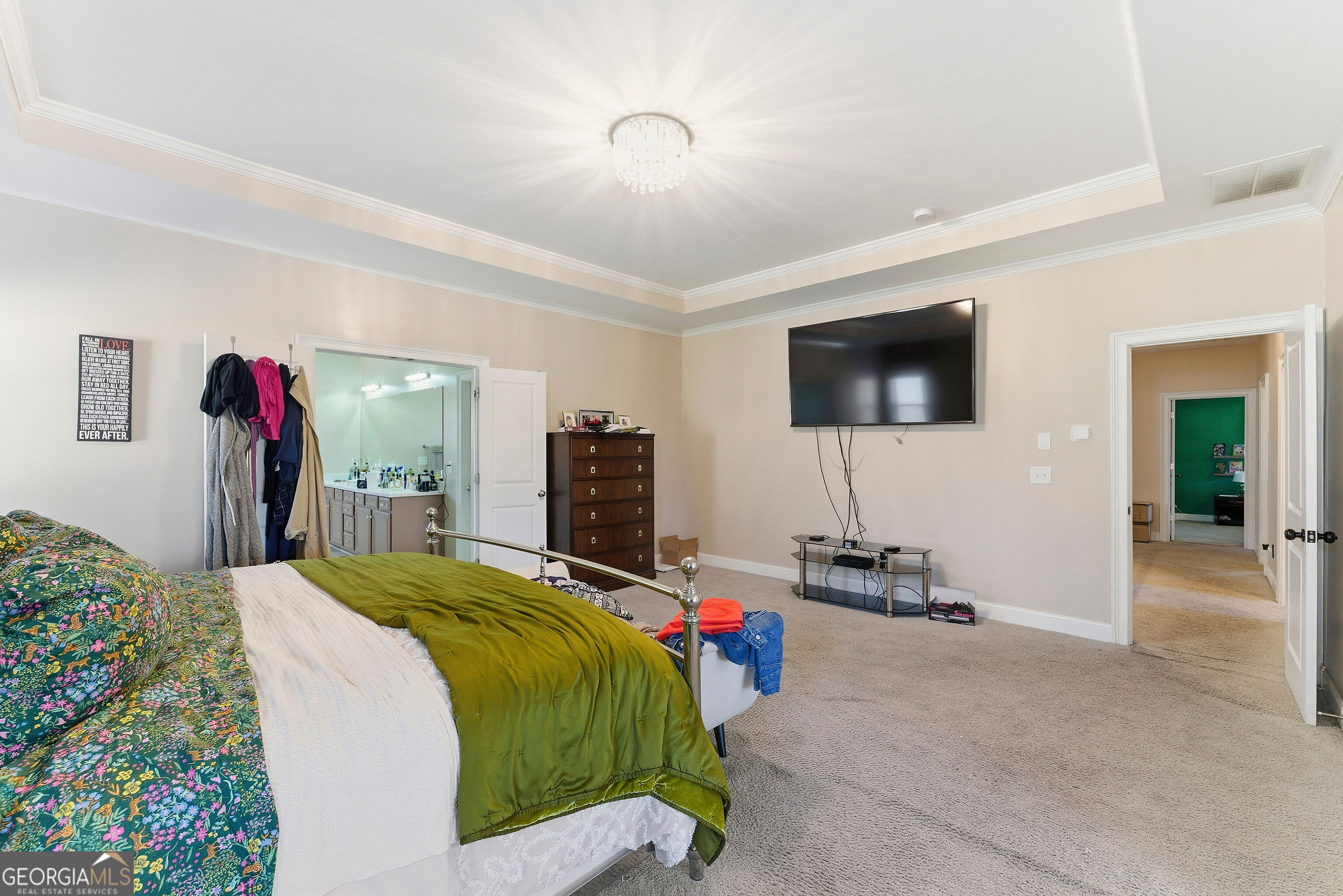 301 Lowell Street Atlanta, GA 30331 - Photo 18 of 28 a bedroom with a bed and a flat screen tv