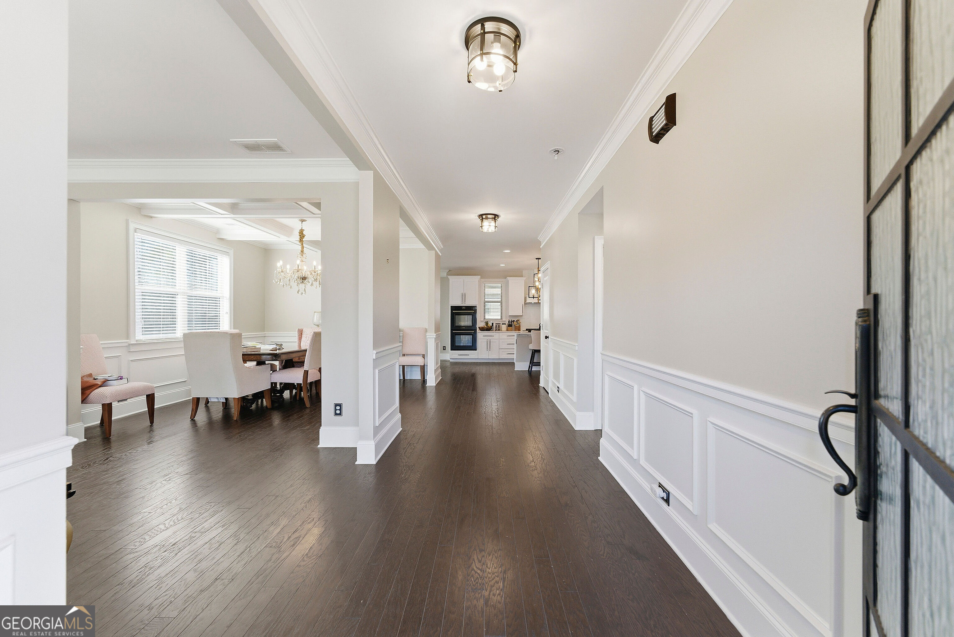 301 Lowell Street Atlanta, GA 30331 - Photo 2 of 28 a view of a hallway with wooden floor and a couch