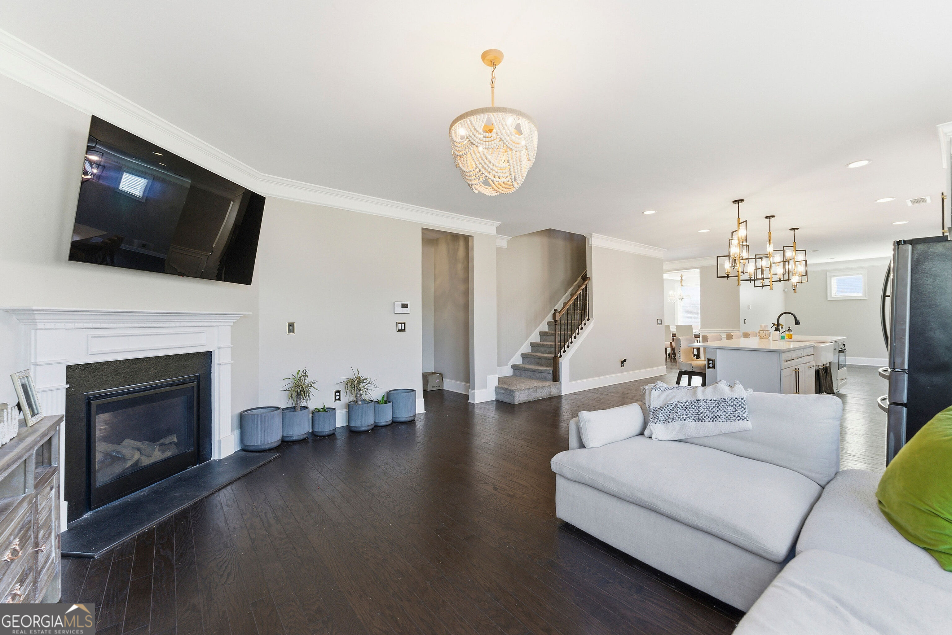 301 Lowell Street Atlanta, GA 30331 - Photo 8 of 28 a living room with furniture a flat screen tv and a fireplace