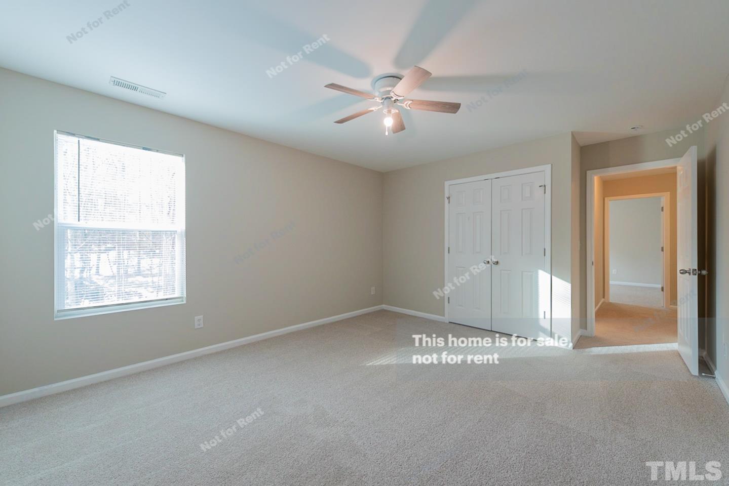 6328 Bunker Hill Drive Raleigh, NC 27610 - Photo 18 of 22 a view of an empty room with chandelier fan and fire place