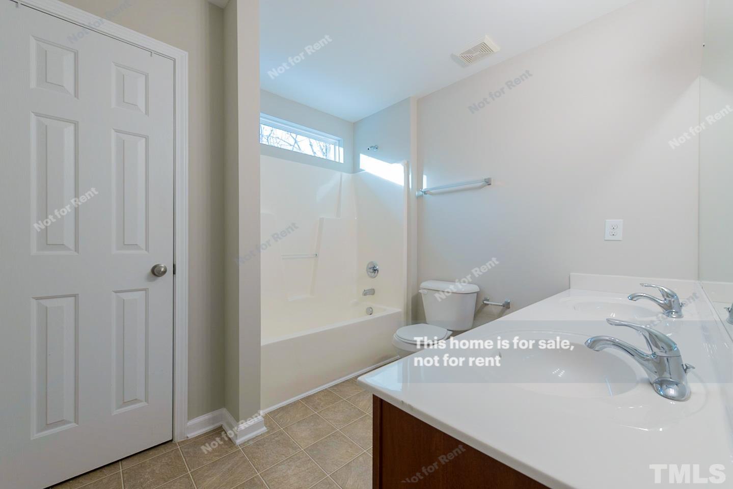 6328 Bunker Hill Drive Raleigh, NC 27610 - Photo 19 of 22 a bathroom with a sink a toilet and shower