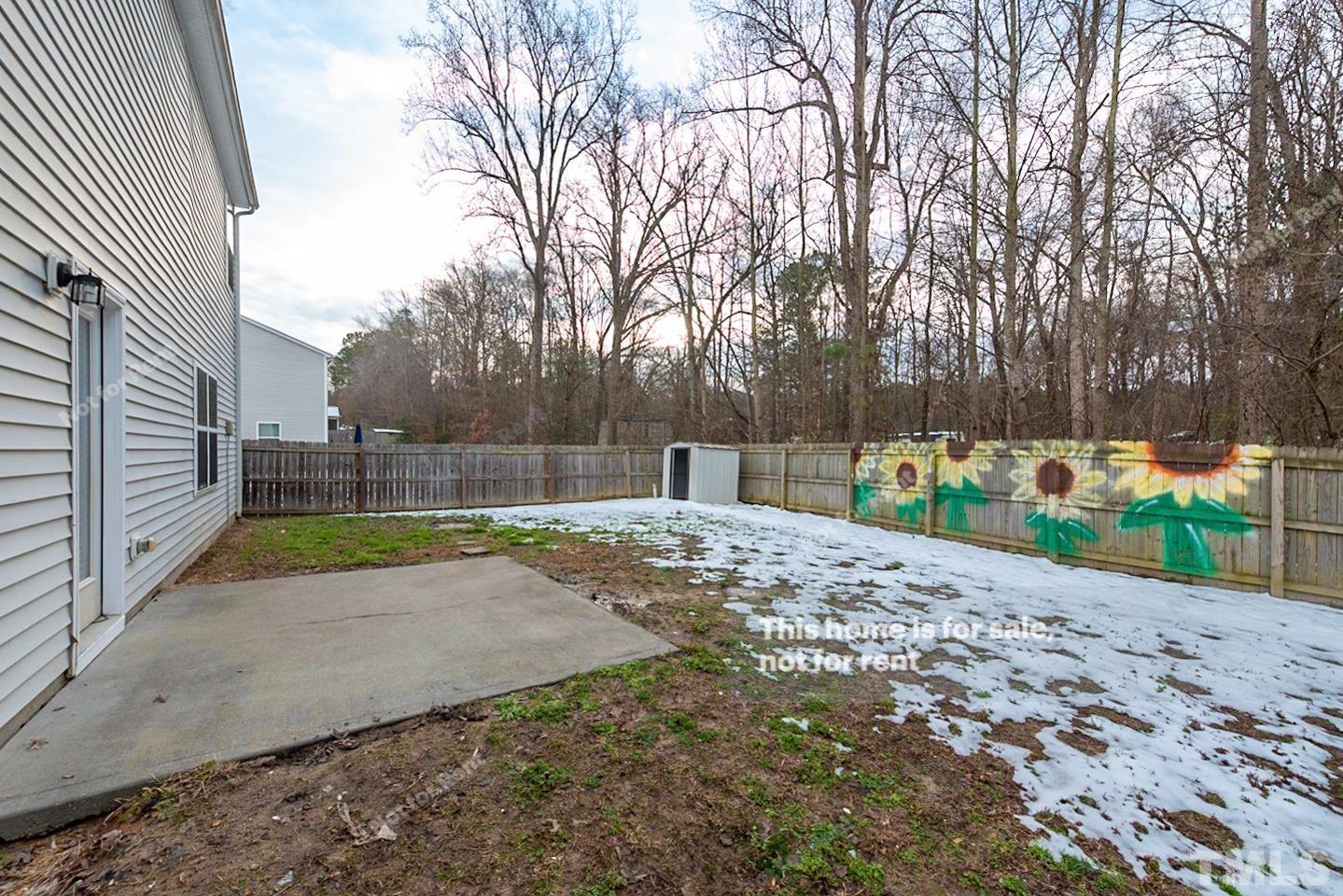 6328 Bunker Hill Drive Raleigh, NC 27610 - Photo 20 of 22 a view of a backyard with large trees