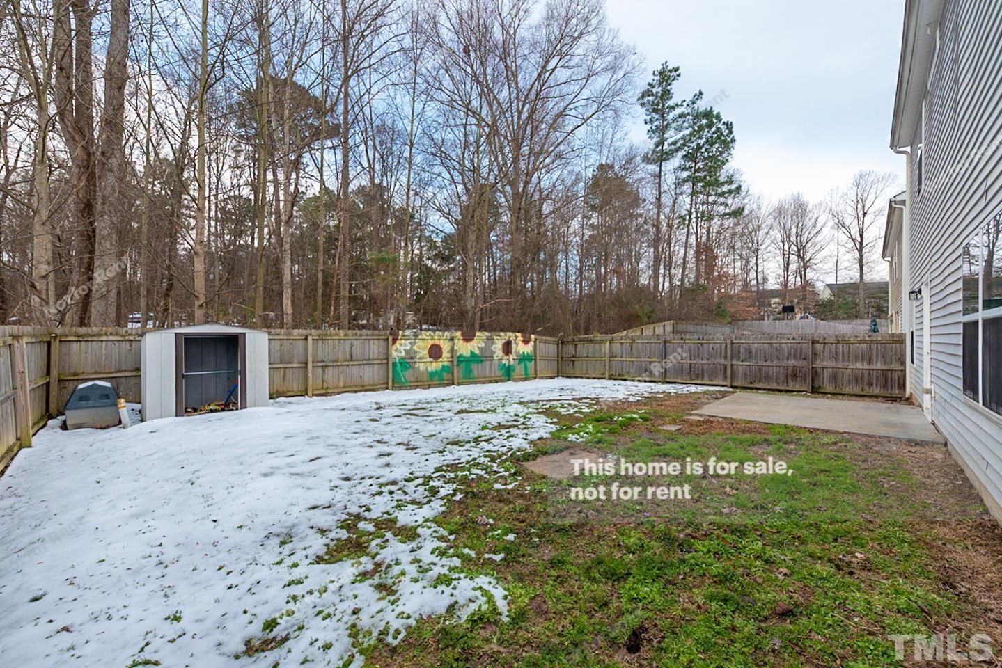 6328 Bunker Hill Drive Raleigh, NC 27610 - Photo 21 of 22 a view of a backyard with a garden