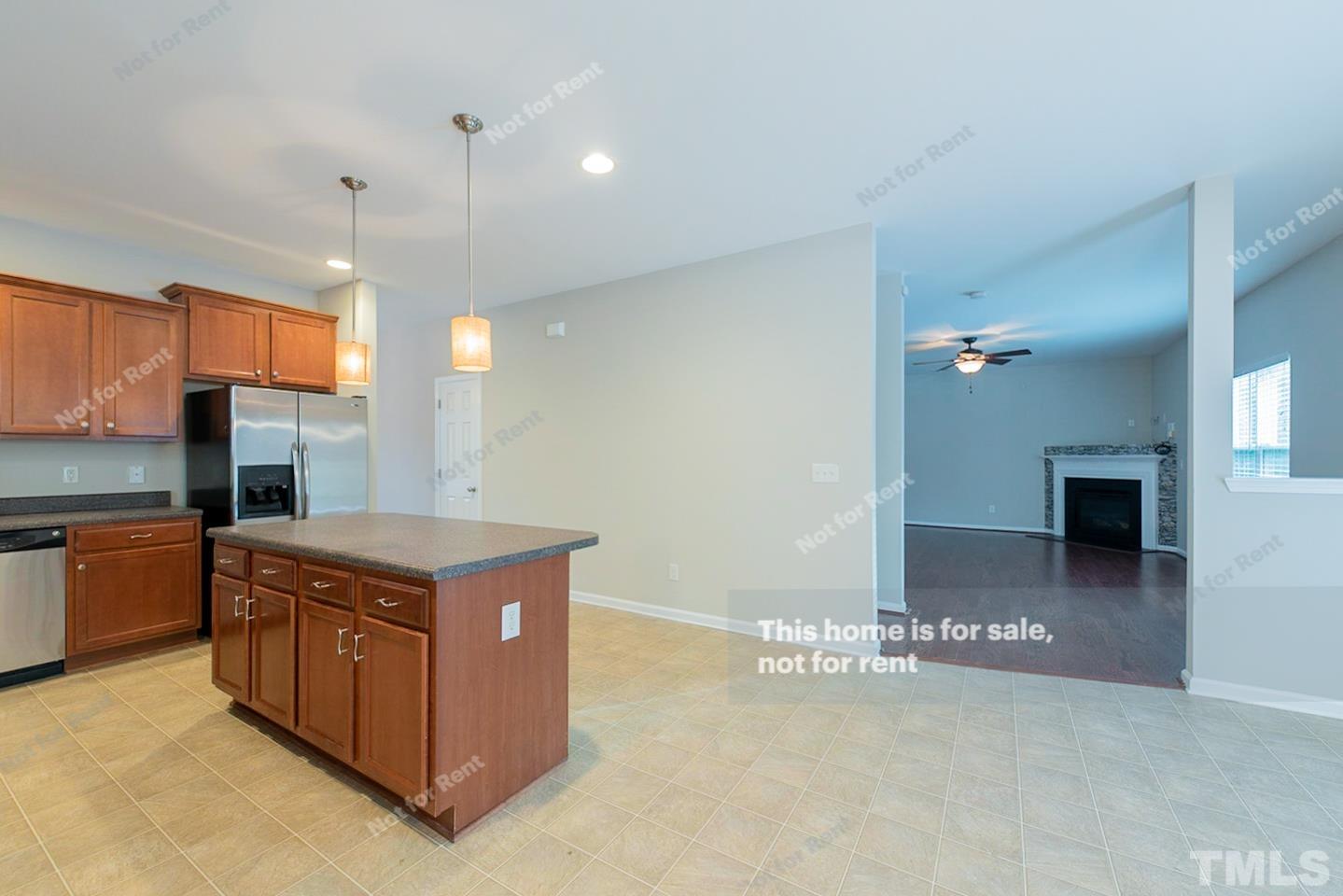 6328 Bunker Hill Drive Raleigh, NC 27610 - Photo 10 of 22 a kitchen with stainless steel appliances granite countertop a stove a sink and a refrigerator