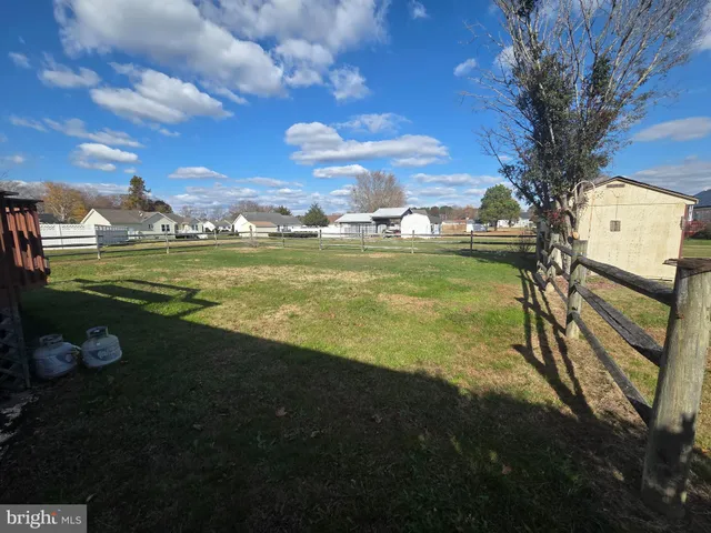 a view of a field with an trees