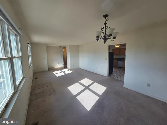 a very nice looking empty room with a window