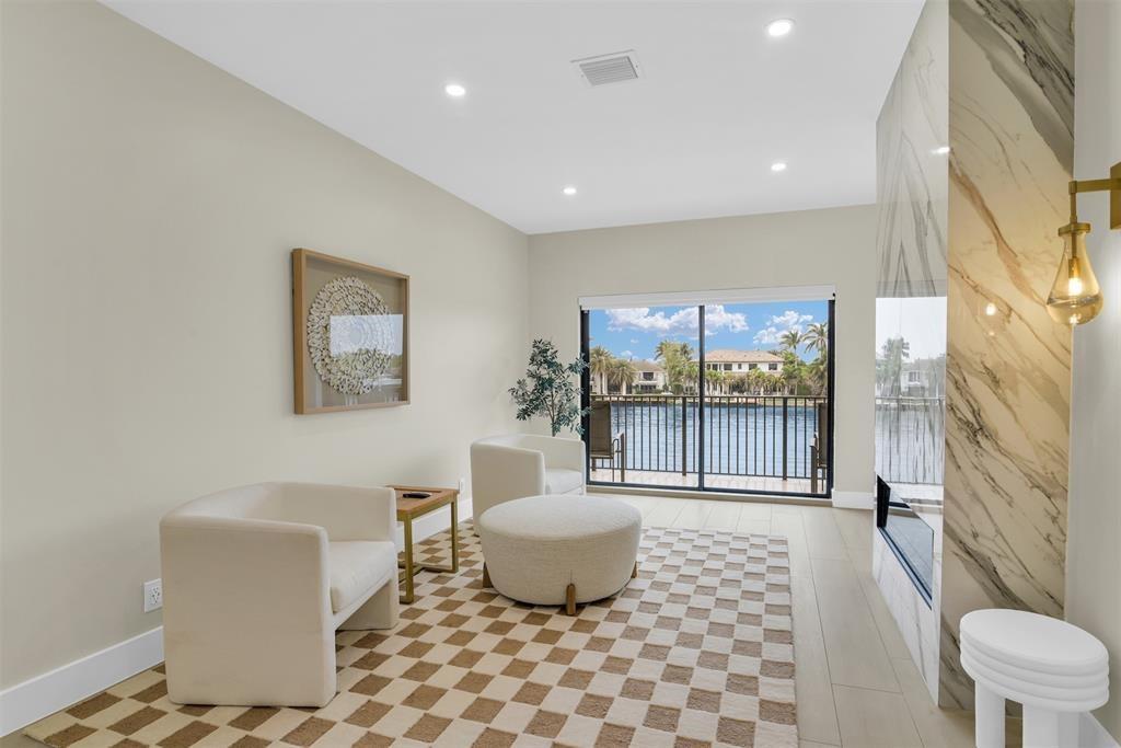 319 South Riverside Drive Pompano Beach, FL 33062 - Photo 33 of 88 a living room with a couch and a table