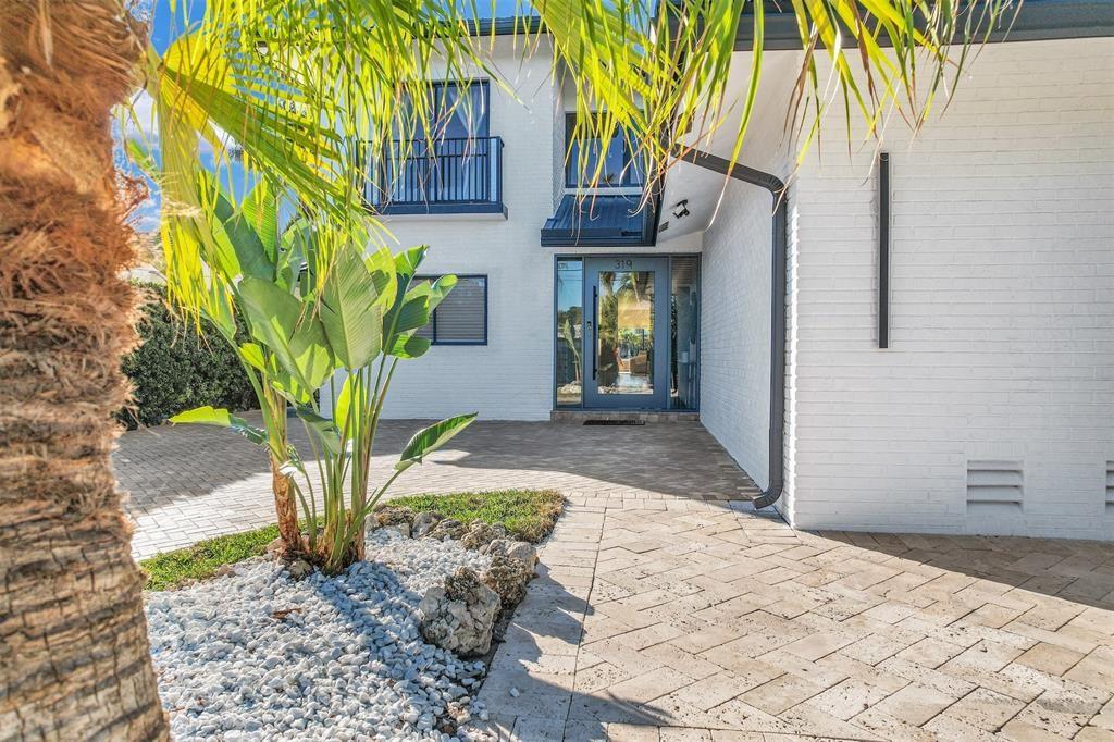 319 South Riverside Drive Pompano Beach, FL 33062 - Photo 64 of 88 a house with palm tree in front of it