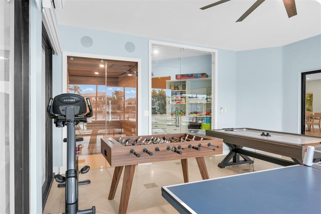 319 South Riverside Drive Pompano Beach, FL 33062 - Photo 67 of 88 a room with gym equipment and a large window