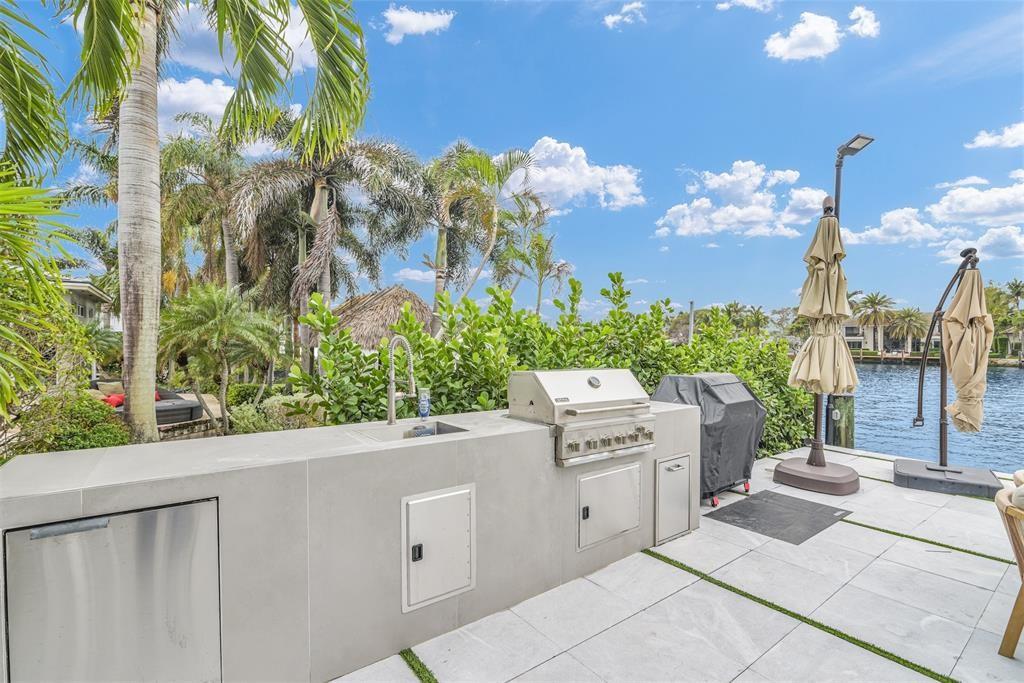 319 South Riverside Drive Pompano Beach, FL 33062 - Photo 79 of 88 a view of a house with a flower garden