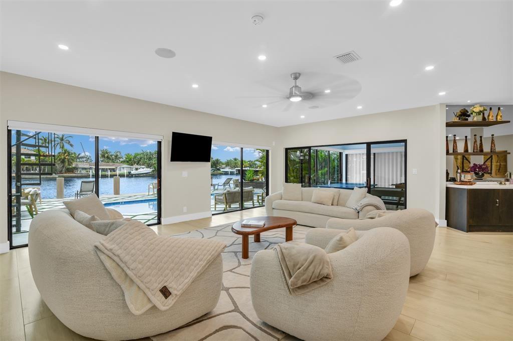 319 South Riverside Drive Pompano Beach, FL 33062 - Photo 9 of 88 a living room with furniture and large window