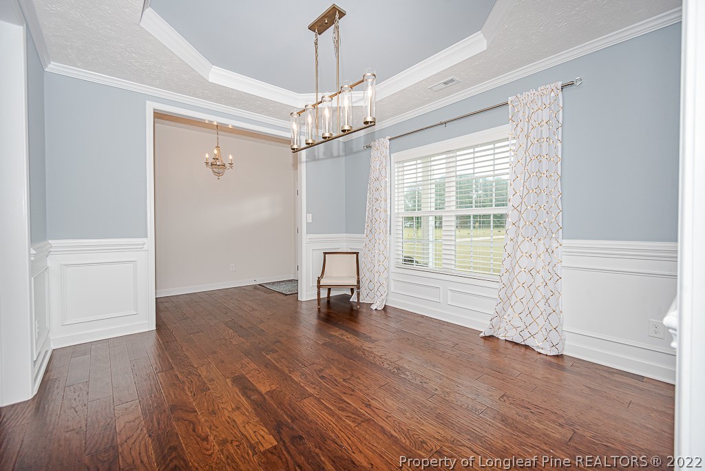 5641 Wade-Stedman Road Wade, NC 28395 - Photo 14 of 46 a view of empty room with wooden floor and fan