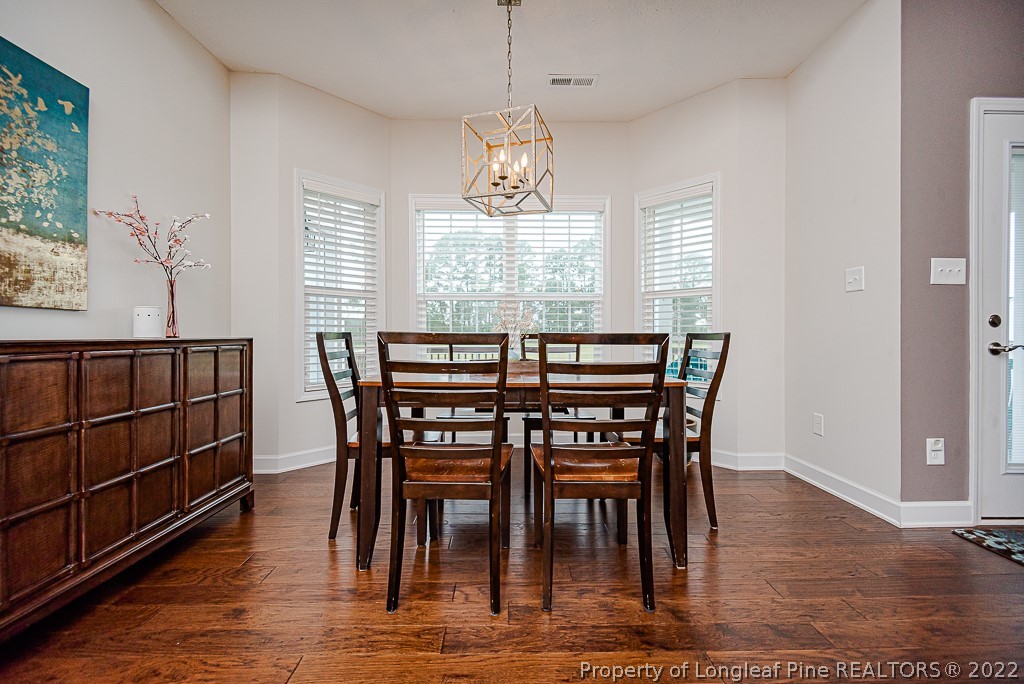 5641 Wade-Stedman Road Wade, NC 28395 - Photo 22 of 46 a dining room with furniture window and wooden floor