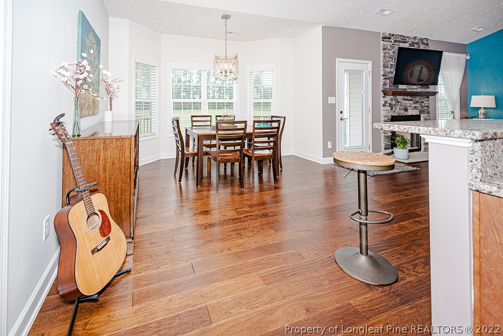 5641 Wade-Stedman Road Wade, NC 28395 - Photo 24 of 46 a view of a dining room with furniture window and wooden floor
