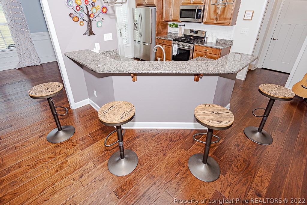 5641 Wade-Stedman Road Wade, NC 28395 - Photo 26 of 46 a kitchen with a table and chairs in it