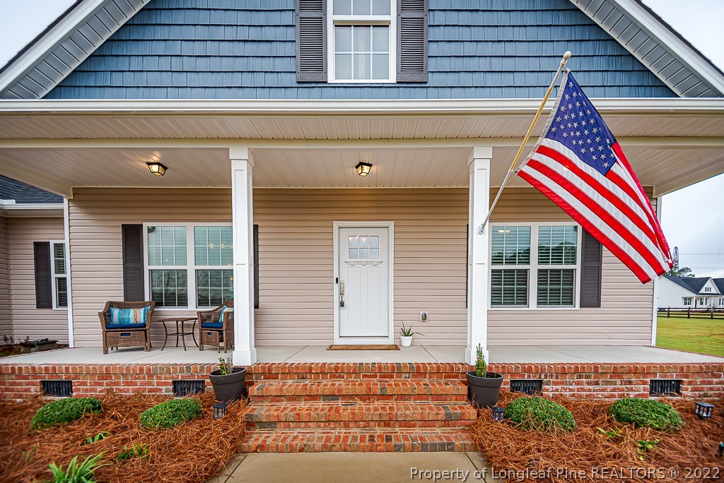 5641 Wade-Stedman Road Wade, NC 28395 - Photo 3 of 46 a front view of a house with a yard
