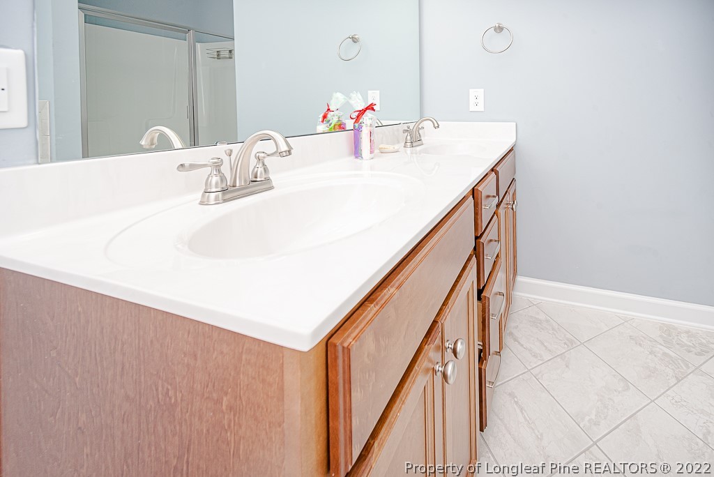 5641 Wade-Stedman Road Wade, NC 28395 - Photo 42 of 46 a en suite bathroom with a sink