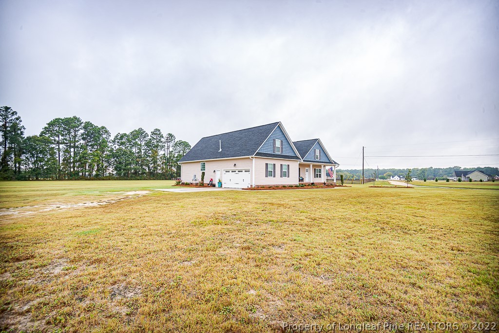 5641 Wade-Stedman Road Wade, NC 28395 - Photo 5 of 46 a view of a lake with houses