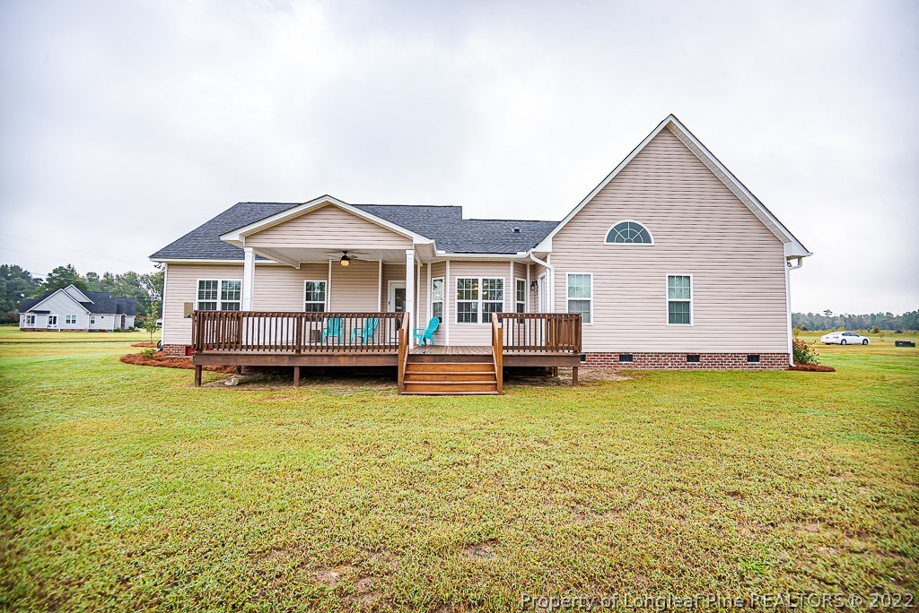 5641 Wade-Stedman Road Wade, NC 28395 - Photo 7 of 46 a view of a house with yard and deck