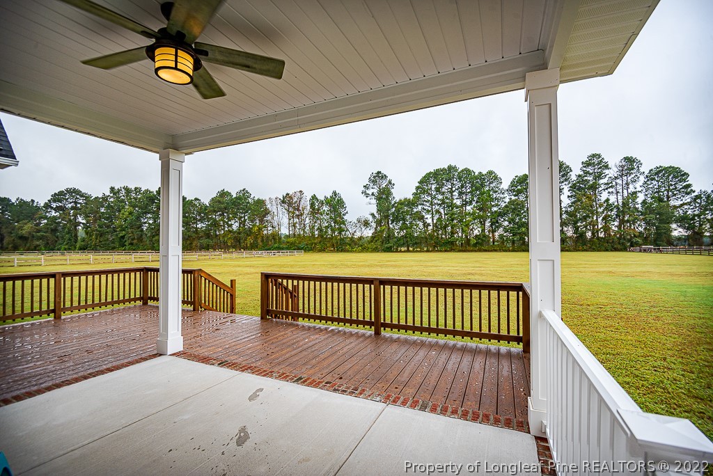 5641 Wade-Stedman Road Wade, NC 28395 - Photo 10 of 46 a view of a balcony with chairs