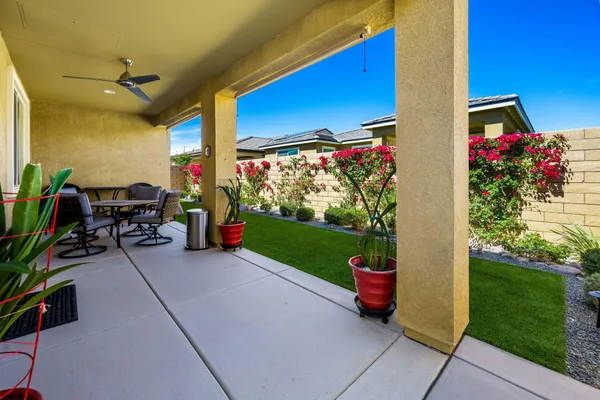 a view of a patio with chairs and table in a patio