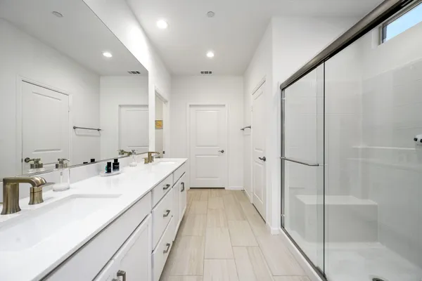 a bathroom with a shower and a tub