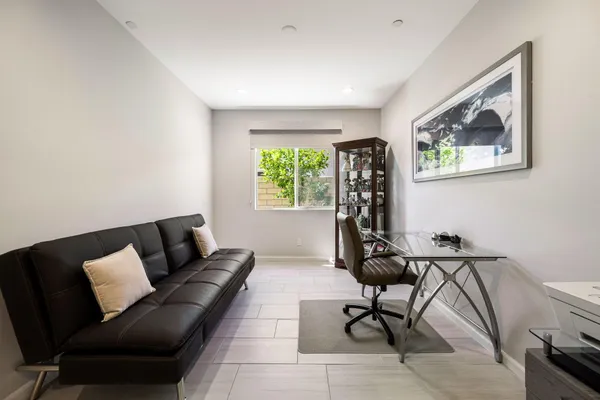 a bathroom with a sink a toilet a mirror and shower