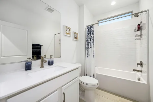 a bedroom with a bed and a table in it