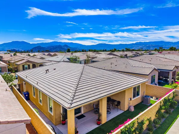 a front view of a house with many windows