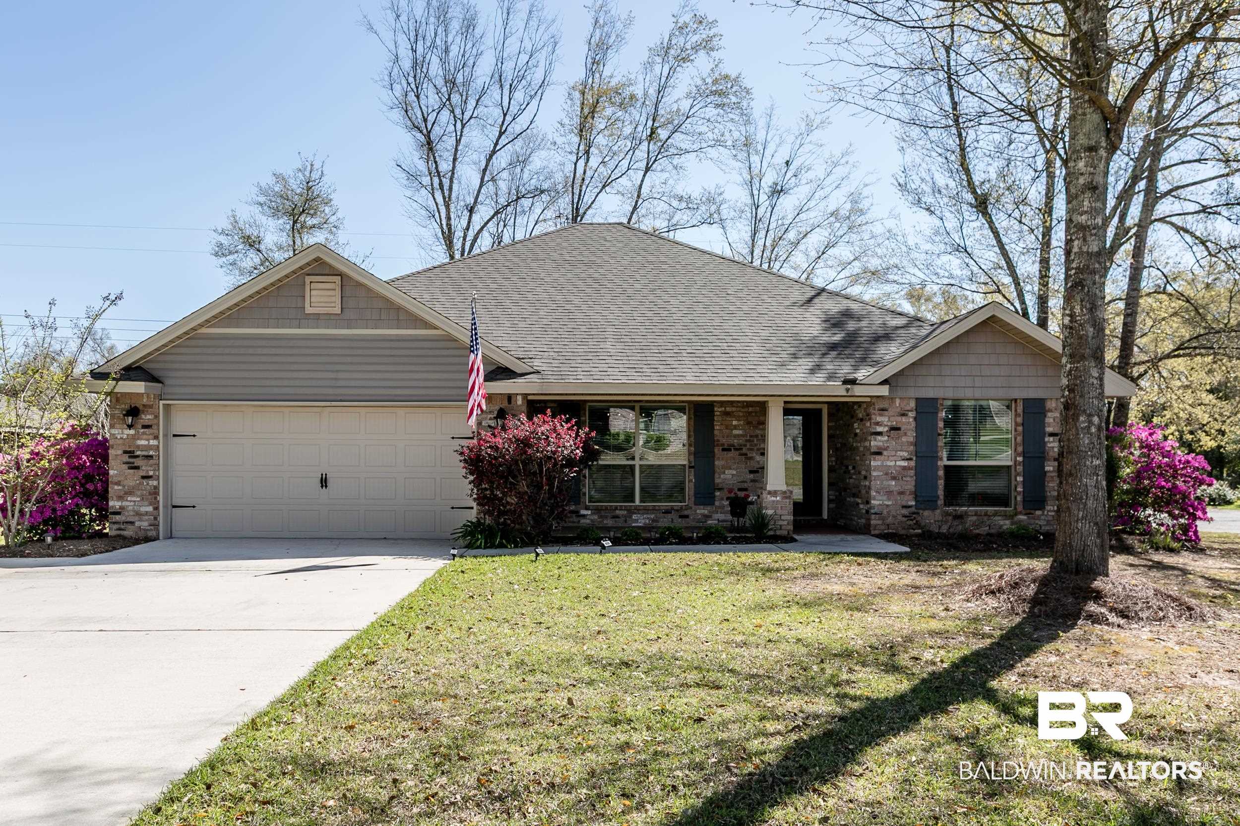 13154 Vincent Court Foley, AL 36535 - Photo 1 of 41 View of front of property featuring a front lawn, a shingled roof, a garage, and concrete driveway