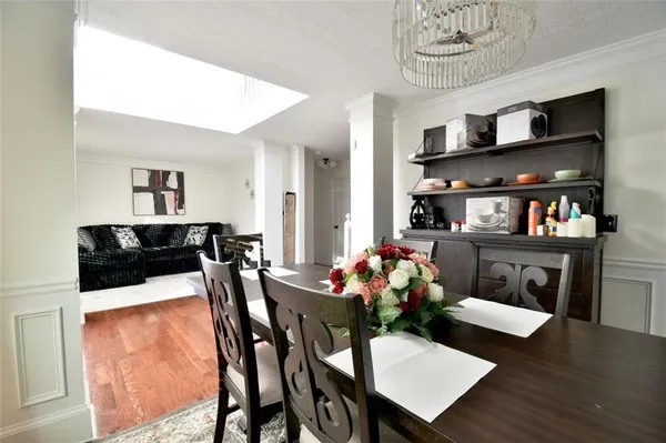 a view of a dining room with furniture and wooden floor