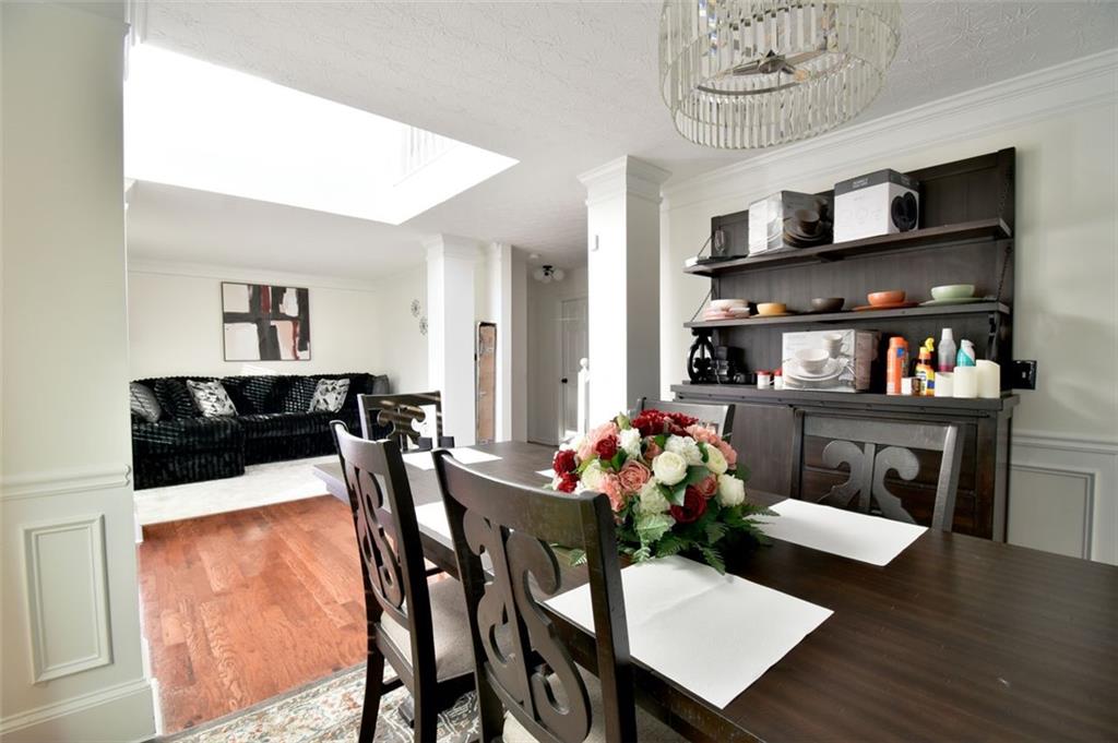 12140 Dominion Drive Hampton, GA 30228 - Photo 13 of 52 a view of a dining room with furniture and wooden floor