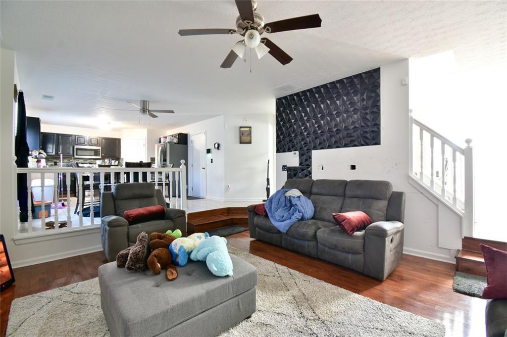 12140 Dominion Drive Hampton, GA 30228 - Photo 22 of 52 a living room with furniture and wooden floor