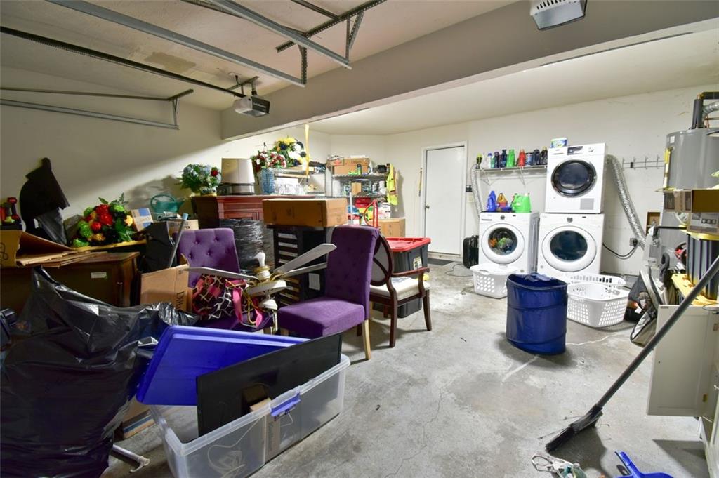 12140 Dominion Drive Hampton, GA 30228 - Photo 29 of 52 a room with furniture and a chandelier