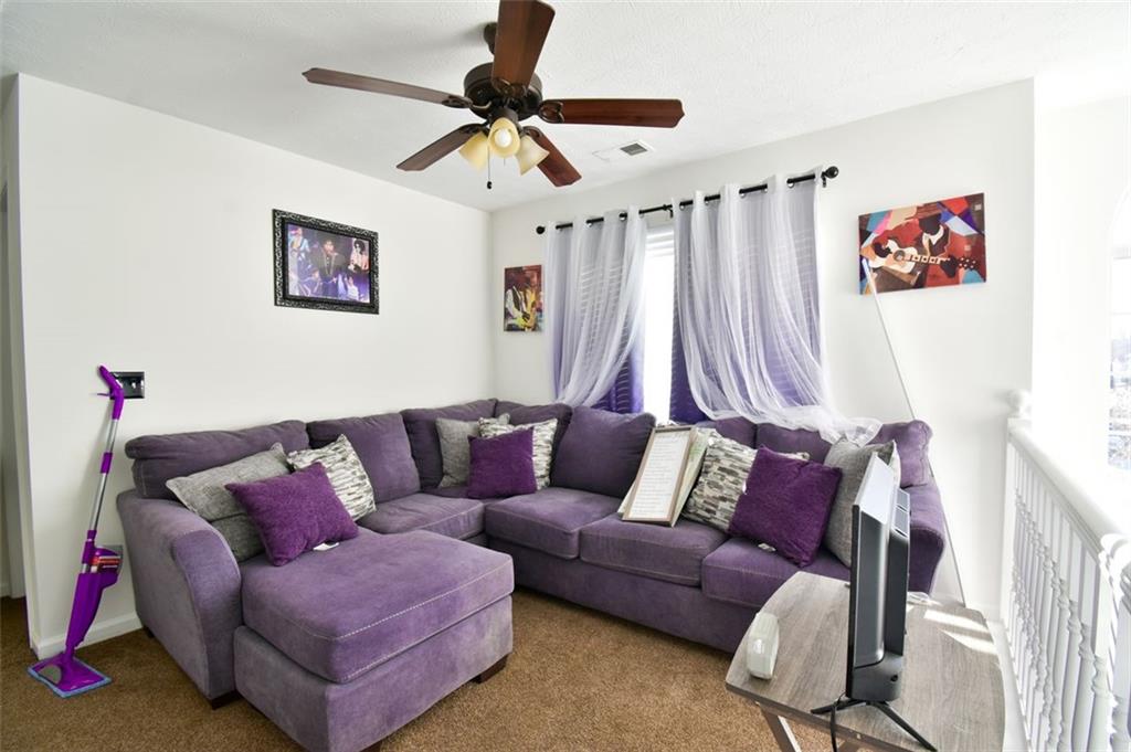 12140 Dominion Drive Hampton, GA 30228 - Photo 32 of 52 a living room with furniture and a couch